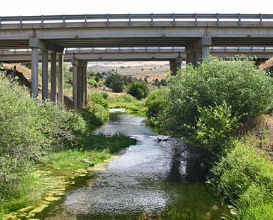 Portneuf River above Marsh Creek looking upstream (east) with I-15 South bridges.