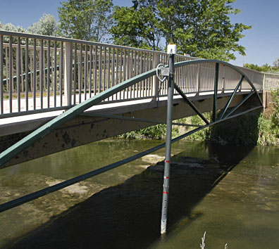 The footbridge provides access to the east side of the river as well as an ideal mount for suspending the monitoring boom.