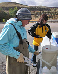 Amanda Rugenski and Melissa Thompson process samples collected from the churn splitter.