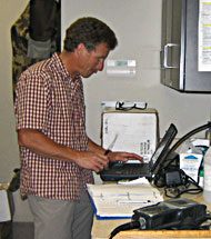 Greg Mladenka calibrates equipment at the Idaho DEQ Laboratory.