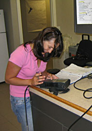 Melissa Thompson calibrating a water quality monitoring sonde at the IDEQ laboratory.